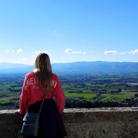 A Benedictine student looking out over an Italian landscape