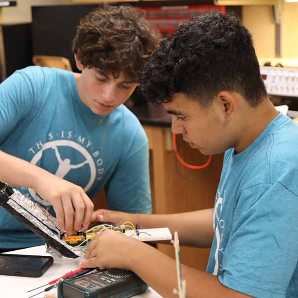 Two BCYC Immersion engineering track students wiring a project 