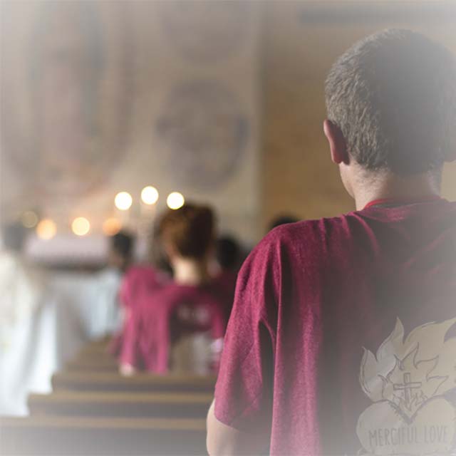 A student prays during Eucharistic Adoration