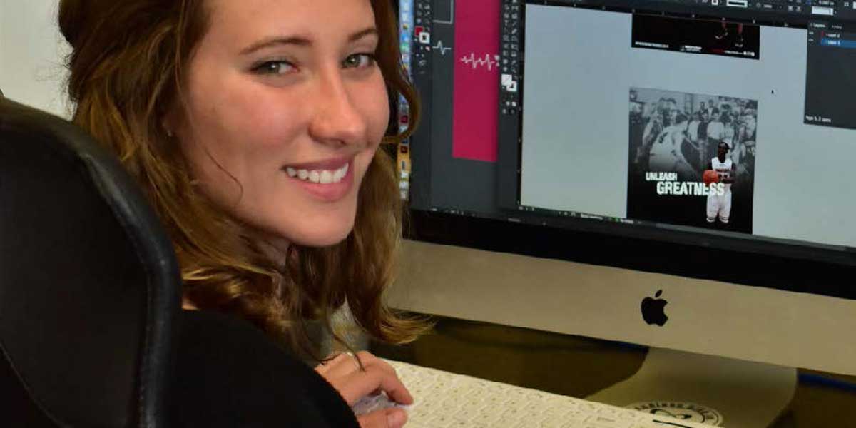 A student works on design projects at a computer.