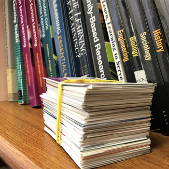 A stack of cards on a bookshelf