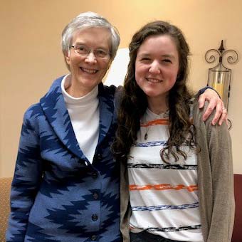 A student with a sister of Mount St. Scholastica Monastery