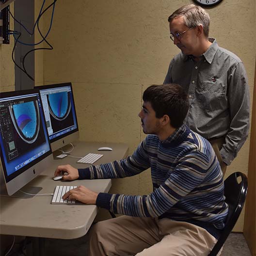 Dr. Maderak assists a student in the Daglen Observatory 