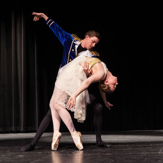 Two students, a man and a woman, dance in a ballet