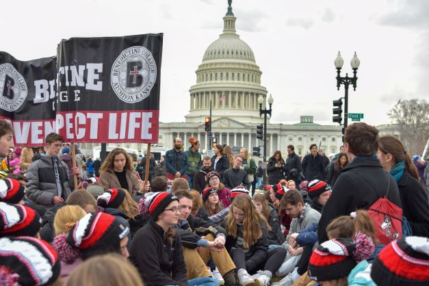 Benedictine Students Pray in front of the Capitol Building during March for Life