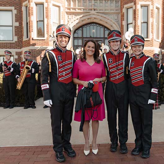 President Katalin Novák of Hungary with members of the Raven Regiment Marching Band