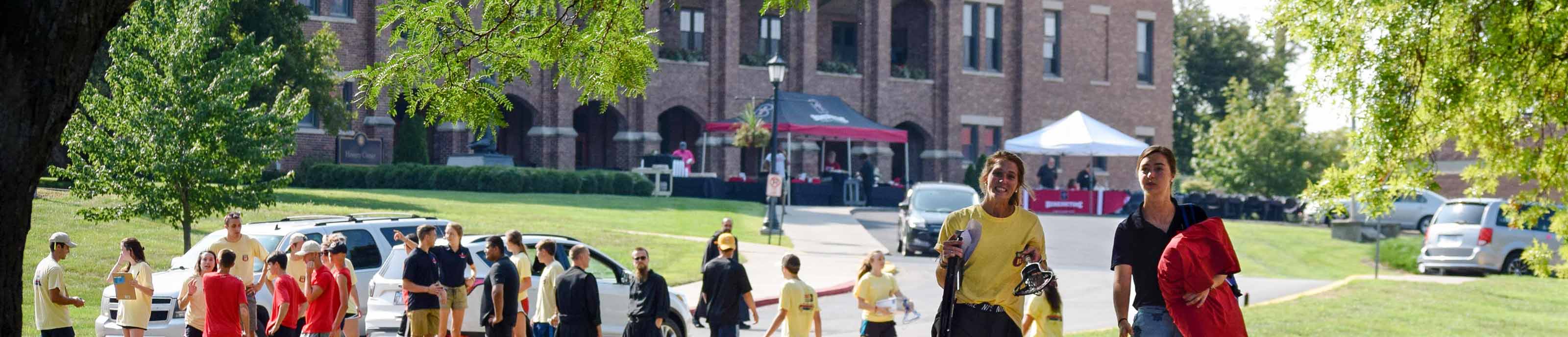 Students, family, monks, and employees busy with move-in day