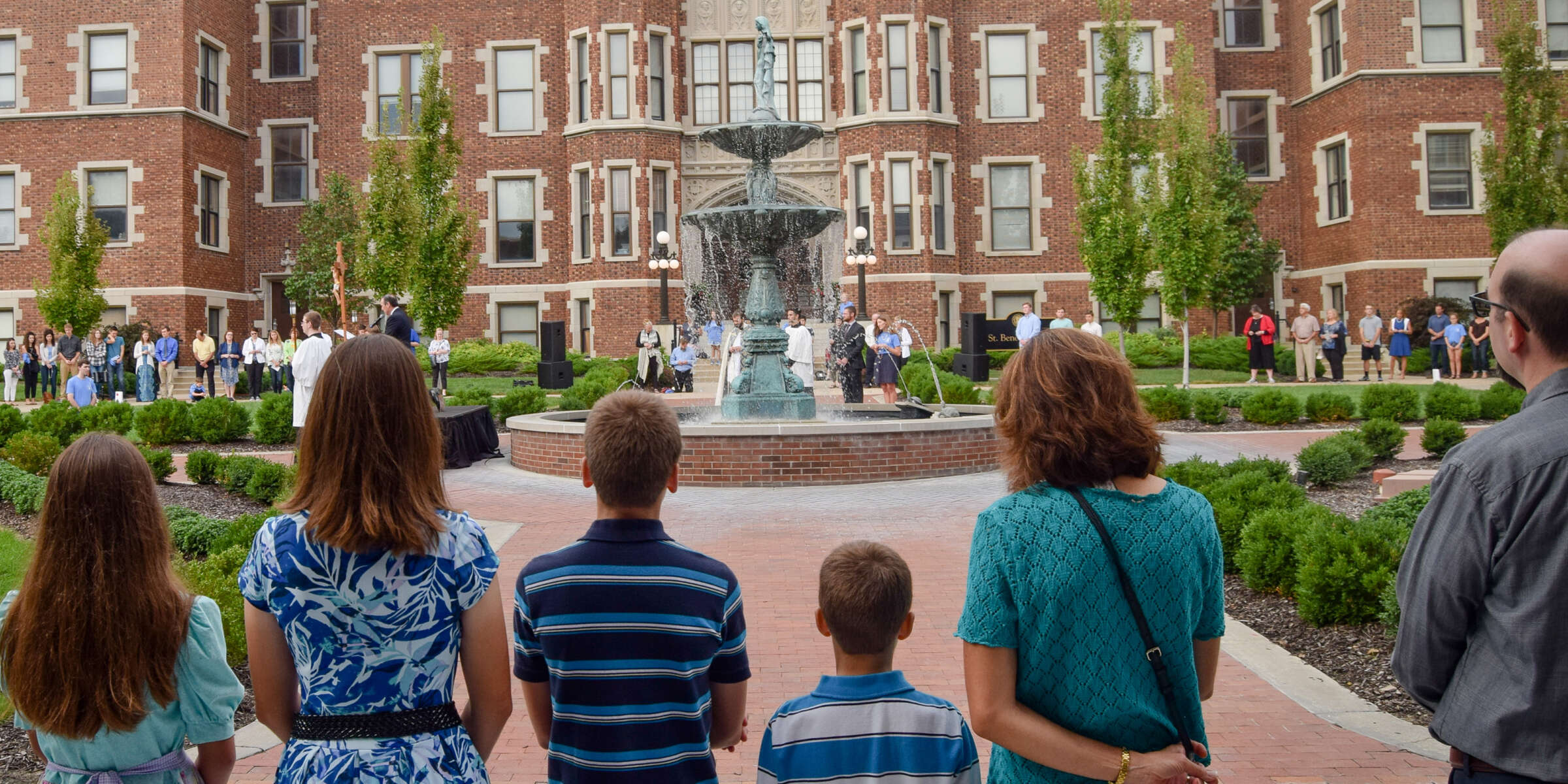 Families praying in the Academic Quad