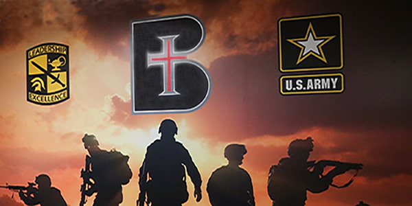 rotc-admissions-top Wall art with silhouettes of five soldiers and the logos of Benedictine College and the U.S. Army